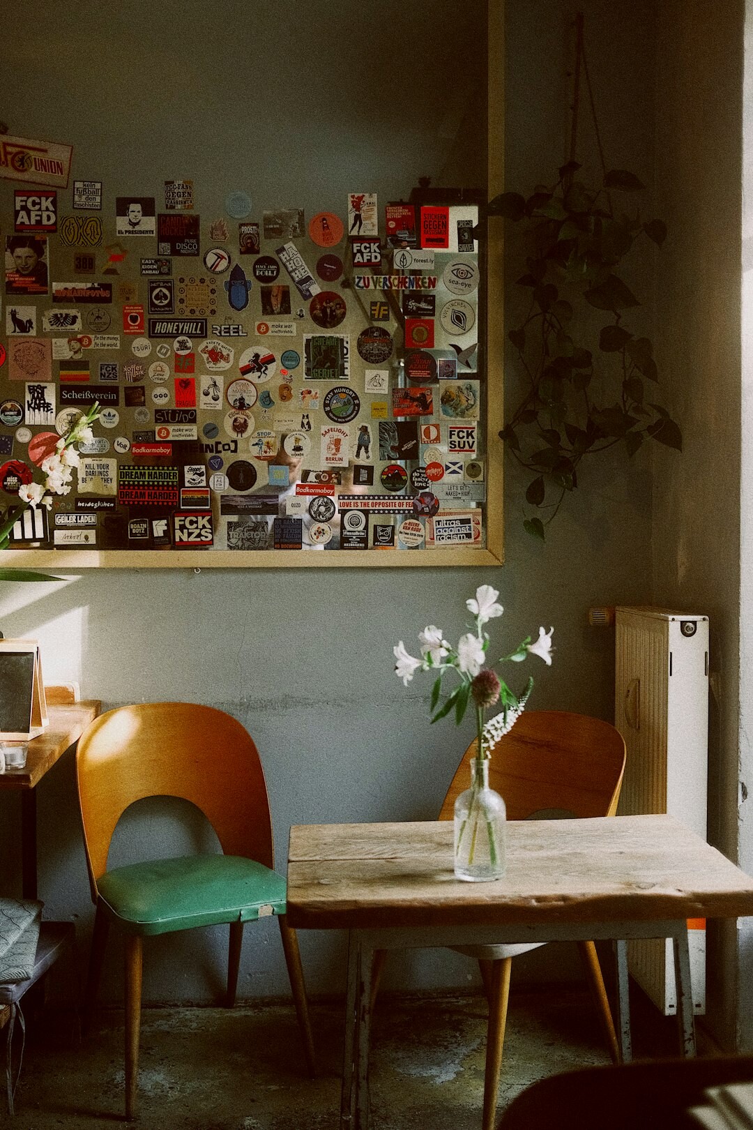Vintage film cameras and photo prints on a wooden table